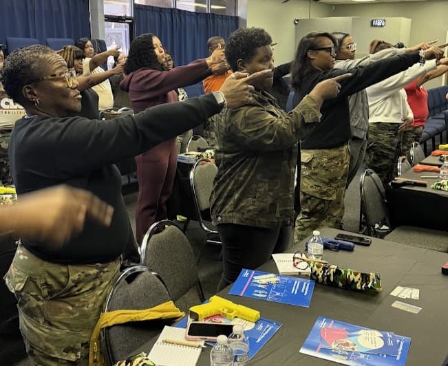 Woman receiving firearms instruction at Gideon Training Solutions