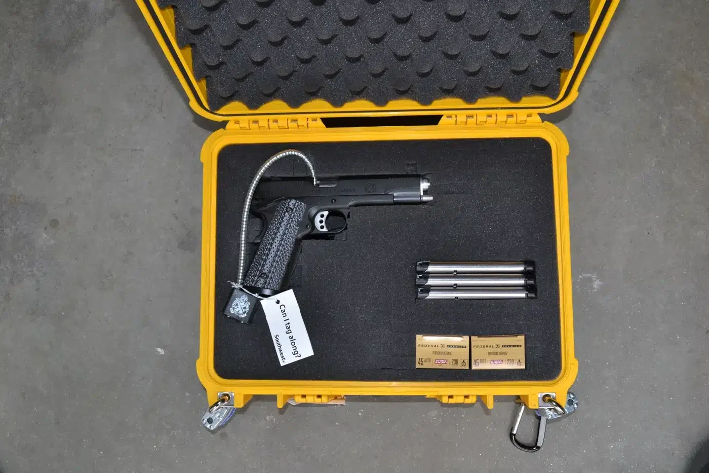 Gideon Training Solutions travel safety and on-the-go preparedness kit displayed in yellow protective case featuring handgun on foam padding, portable door alarm, travel door lock, window security bar, compact personal safe, tactical flashlight, and personal alarm for hotel, road trip, camping, and extended travel security across DFW and North Texas