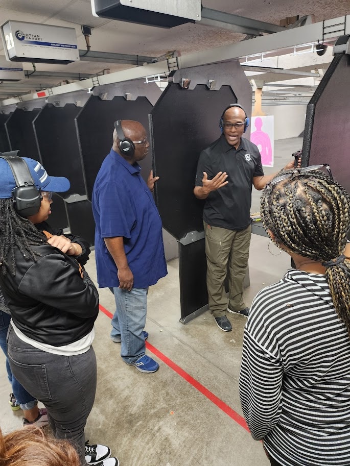 Small group of students with hearing protection attending a beginner-friendly Firearm Safety and Fundamentals course with Gideon Training Solutions instructor. Three-hour beginner-friendly course covering essential firearm safety rules and basic shooting fundamentals. Firearms safety class available in Dallas, Fort Worth, Mansfield, Arlington, Grand Prairie, DeSoto, and across all DFW and North Texas cities.